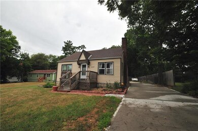Very wide and lengthy driveway leads to the back d