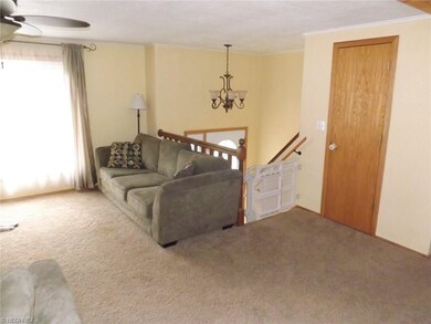 Another view of the living room space with hall co