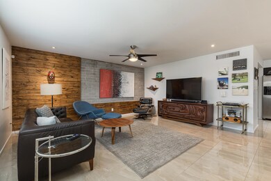 Living room- exposed block + wood wall