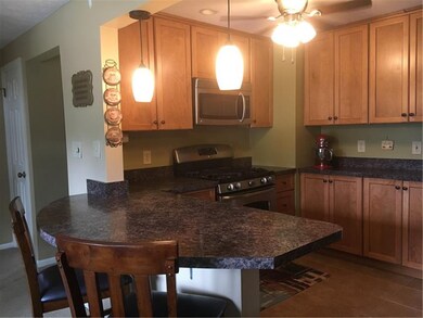 Custom kitchen with maple cabinetry, five burner g