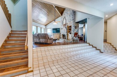 Living room with beautiful wood plank vaulted ceiling