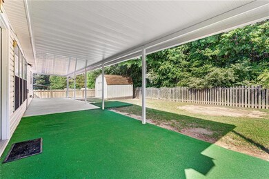 View of yard featuring a storage shed, an outbuild