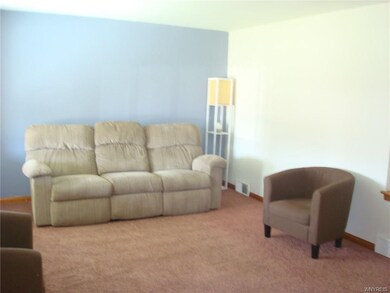 Living Room with w/w carpeting over hardwood floor