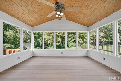 Screened in Composite Deck with Wood Planked Ceiling with Fan