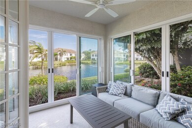 Sunroom with ceiling fan and a water view