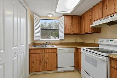 Kitchen. Washer and Dry located behind the folding