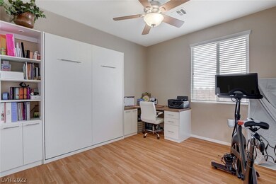Downstairs Den With Built-in Desk, Cabinet, and Mu