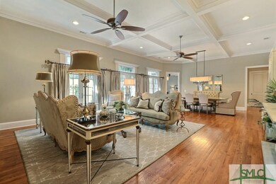 Open living and dining room with coffered ceiling