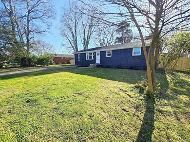 Lovely front yard with mature trees.