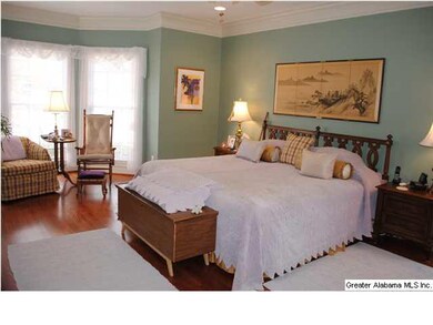 Master bedroom with large windows to let in the su