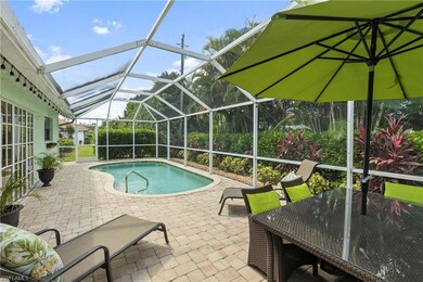 Swimming pool with a lanai, a patio, a sunroom, and outdoor dining area