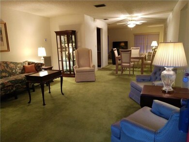 Open floor plan view of living room into dining an