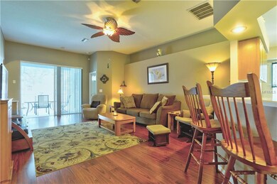Open family room with sliders to screened in pool