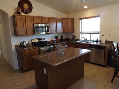OPEN KITCHEN W/MAPLE CABINETS