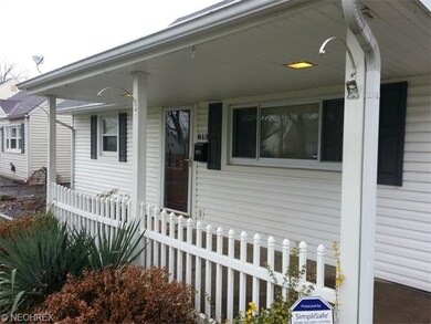 Spacious covered porch area with a white picket fe
