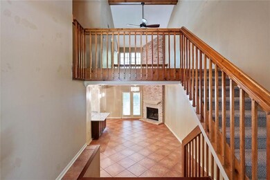 Open and Airy Living Room with Expansive Bricked F