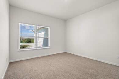 Unfurnished room featuring carpet floors and baseboards