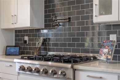 Check out this big commercial sized  gas range with water over stove for easy cooking with many pots at one time