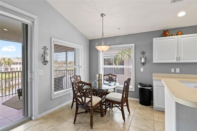 The breakfast nook is conveniently next to the kitchen, with access through sliding glass doors and views of the lake.