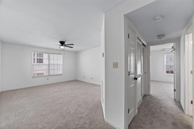 Entry opens to hallway accessing utility closet, b
