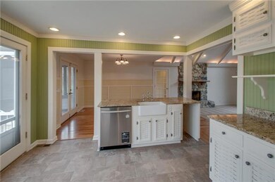 Professional grade appliances are located throughout the kitchen. A new stainless steel wine cooler was recently added to the home.