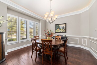 The formal dining room with crown molding, chair molding and LED mood lighting.