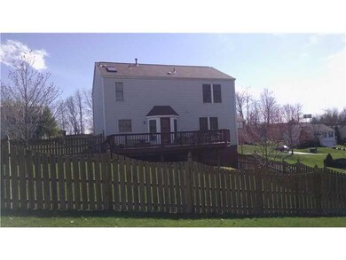 Exterior Back. Deck over looking the fenced yard