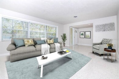 Spacious living room with entry foyer greets you w