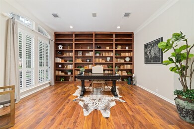 This spacious home office features a large built-i