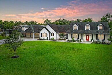 Its striking exterior is composed of beautiful slurried brick that was designed by Todd Manchaca. Every corner of this stunning property features classic touches that offer style and charm. To the left of the main home is a three-car garage with an additional RV-dedicated carport to the left of that.