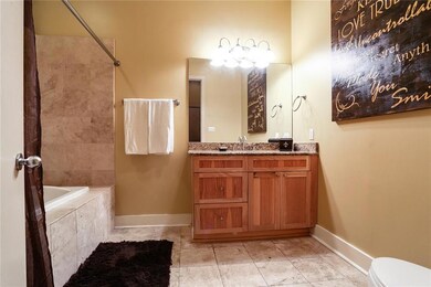 The master bath has a large jetted tub.