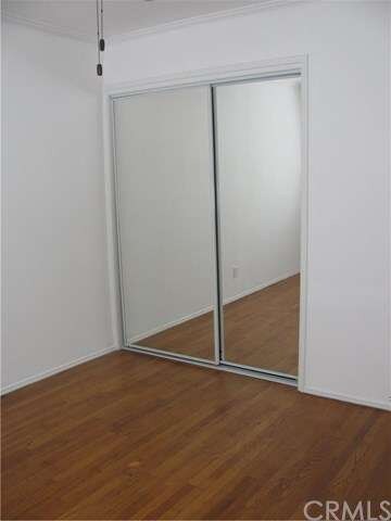 bedroom one - has new mirrored closet doors and ce