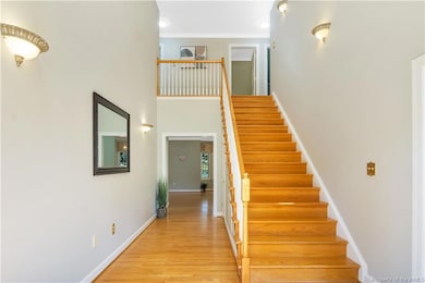Grand Two Story Foyer with Cathedral Ceiling allows plenty of natural light