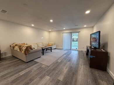 Living room featuring recessed lighting and wood finished floors