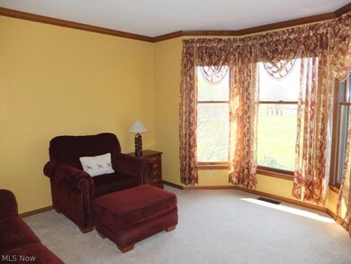 Formal living room or first floor office with crown molding.