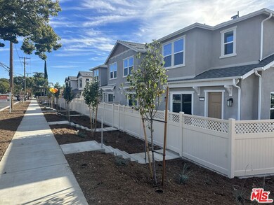 View of E 9th Street homes with large patios