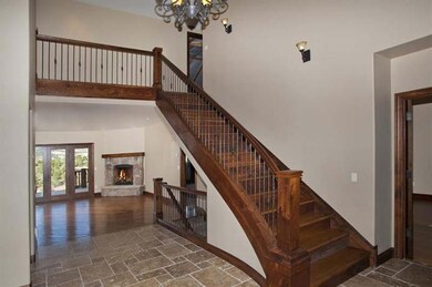 Gorgeous custom staircase at entry which