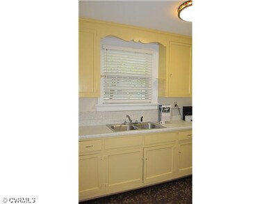 Kitchen - Original wood cabinets with glass knobs,