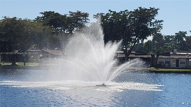 WATER FOUNTAIN IN MIDDLE OF THE LAKE