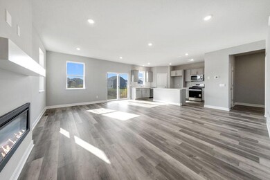 One of many highlights in the main level, the homes fireplace offers a touch of modernization of a space already loaded with a contemporary layout!  Photo of previously built model, colors and selections to vary.