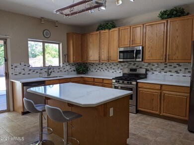 Kitchen Island with pot rack above