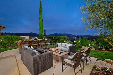 Cozy elevated fire pit and built in BBQ with beaut