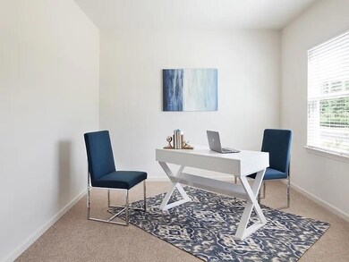 Office space featuring light carpet