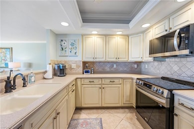 Kitchen featuring stainless steel appliances, a ra