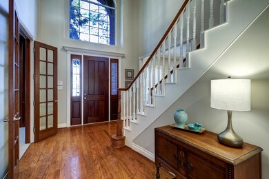 Inviting Foyer features hardwoods, high ceiling