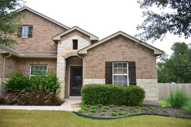 View of front of property featuring brick siding 