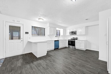 New appliances and white quartz counters complete