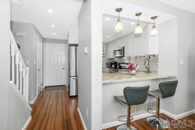 View of Front Entrance and Kitchen.