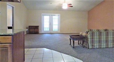 View of living room from front entry. French doors