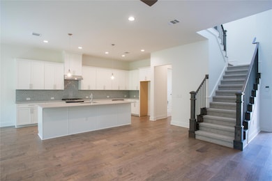 Kitchen featuring under cabinet range hood, visib